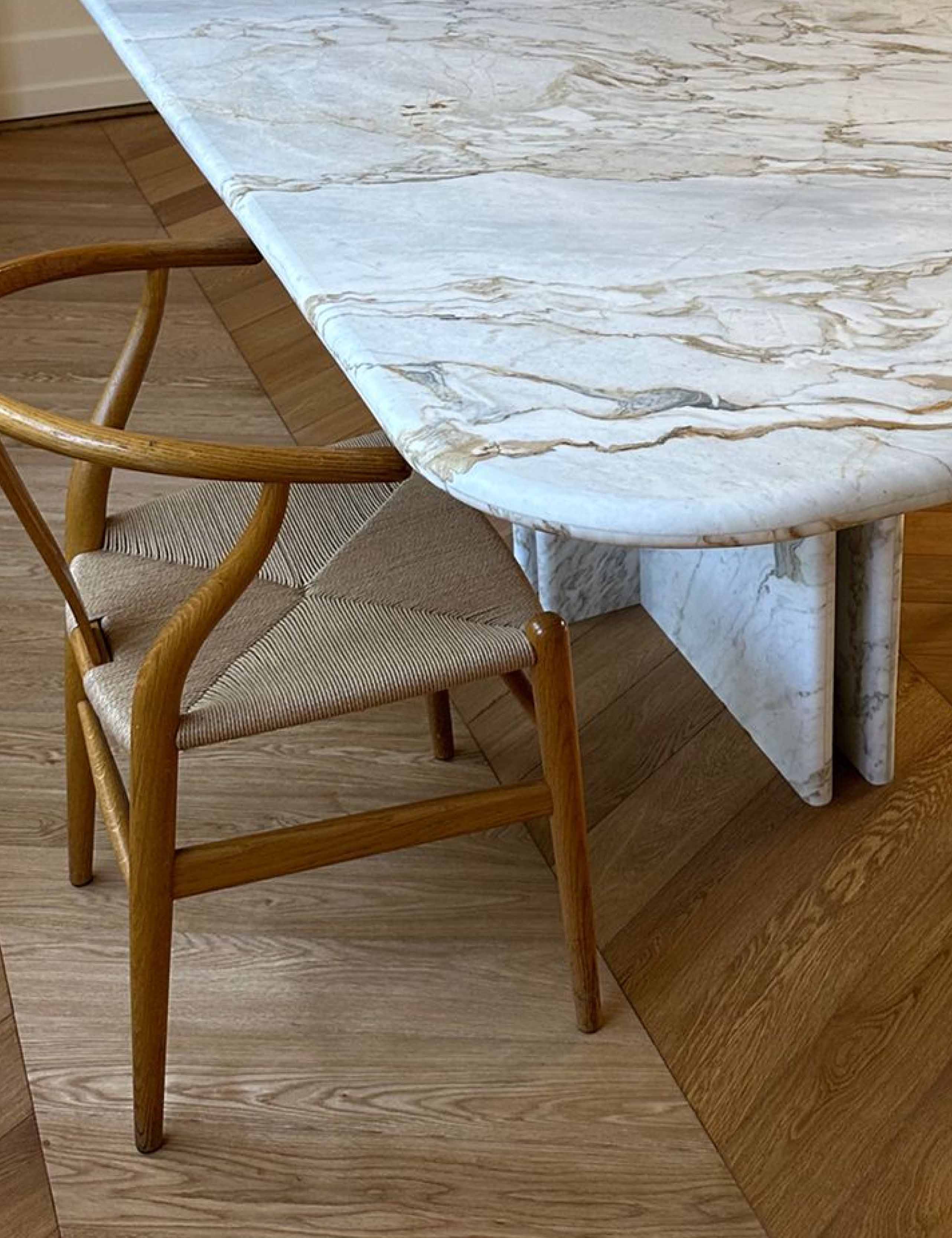 Detail of marble dining table table top with rounded bullnose edge, in ceppo di vagli marble.