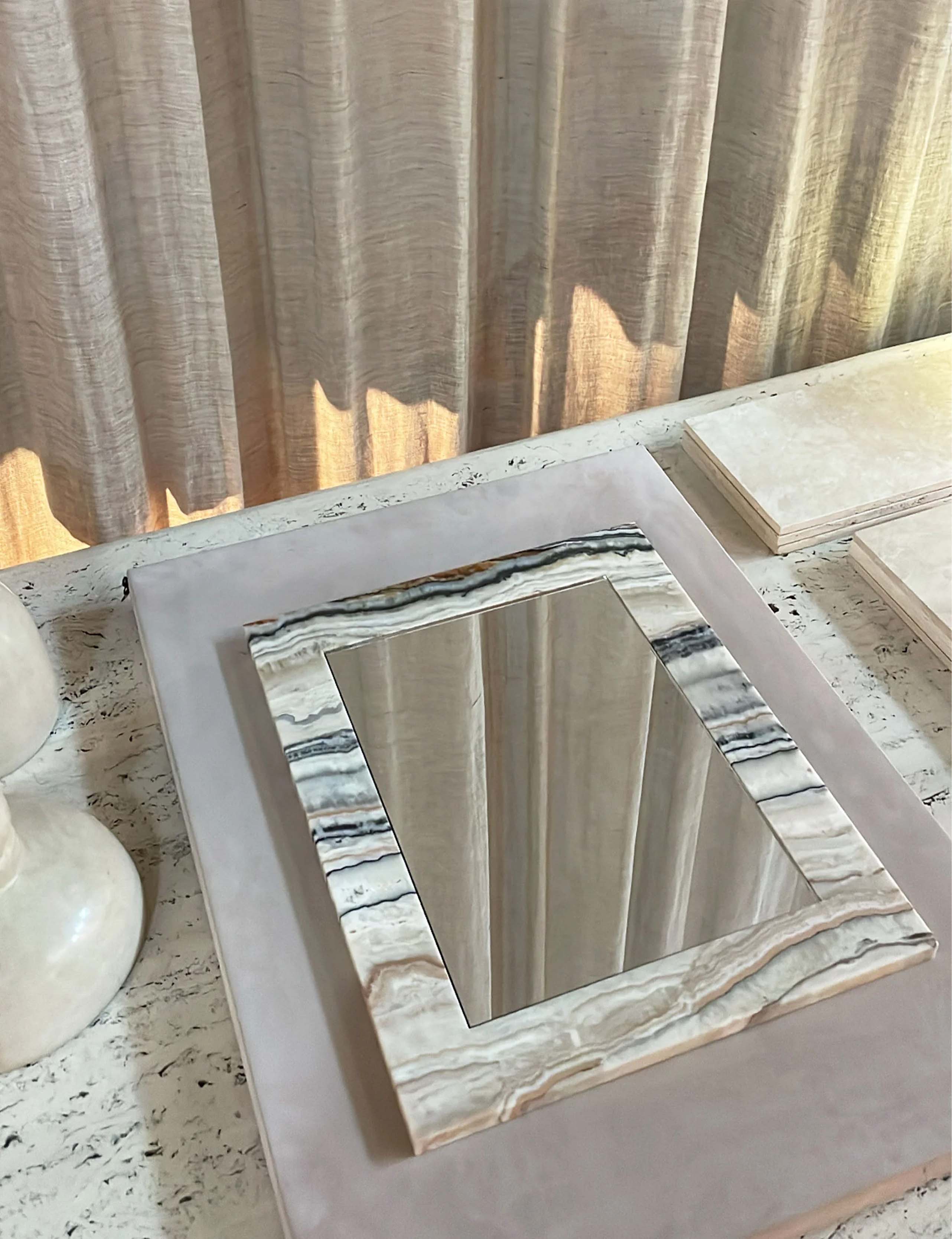 Opal Desert Linea Onyx mirror styled in interior setting with warm natural stone frame and elegant linear veining